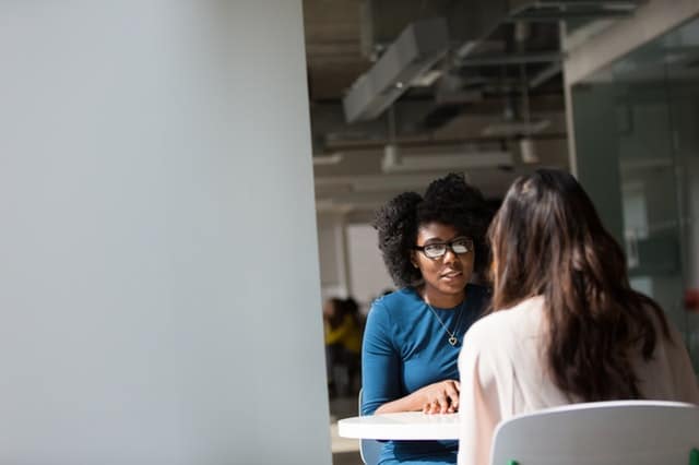 Conversational Competence | 10 ways to have a better conversation | Image of two woman talking at a table